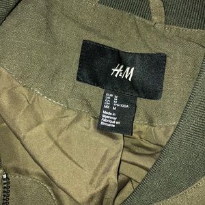 Dark green zip up jacket